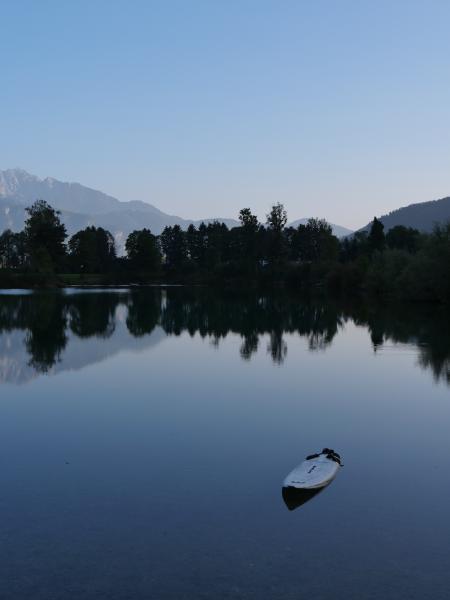 Small lake with mountains in the background.