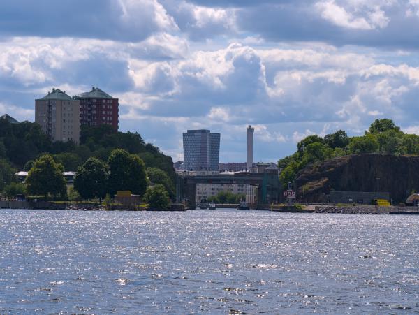 Some buildings on the Stockholm coast. There is some kind of bridge.