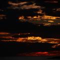 Fire Behind the Clouds - Burning Sunset Over the Sea