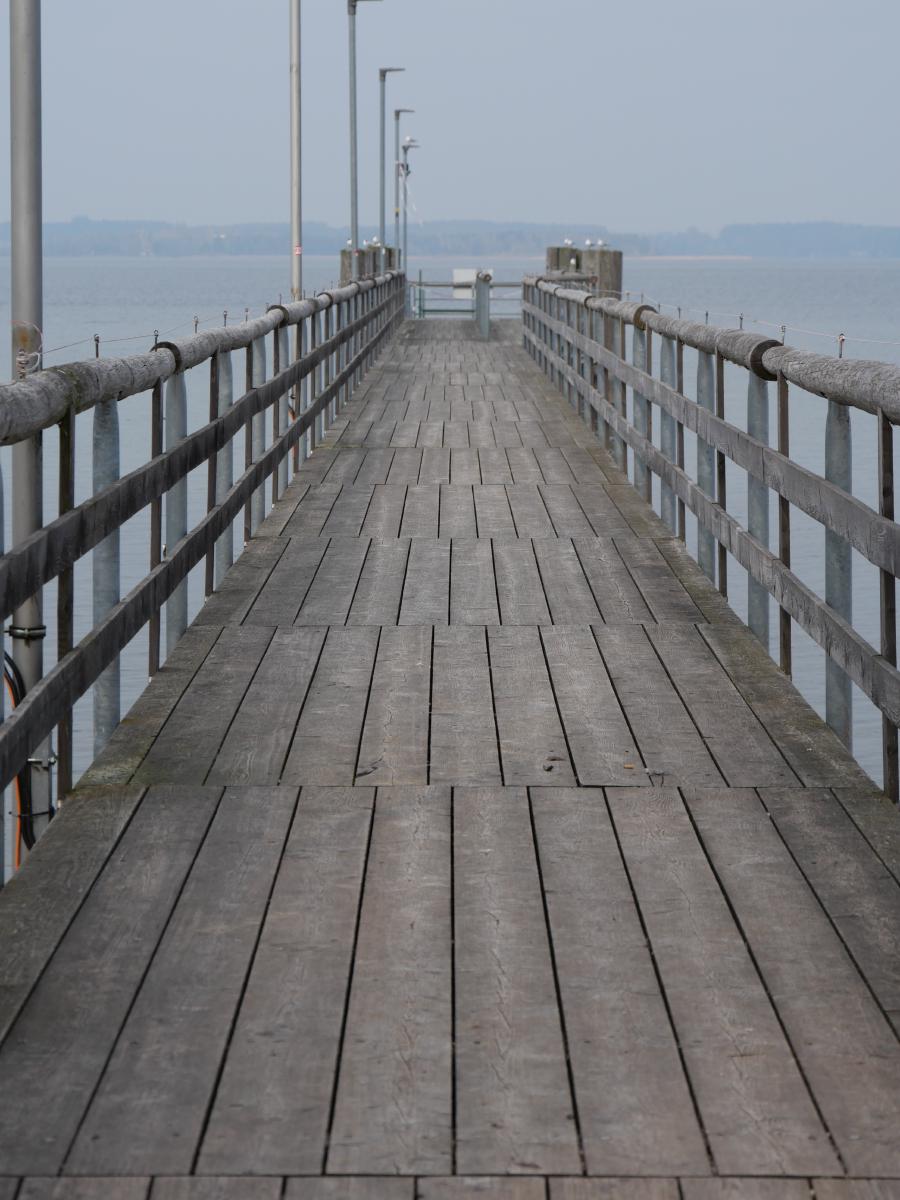 A pier going into a lake.