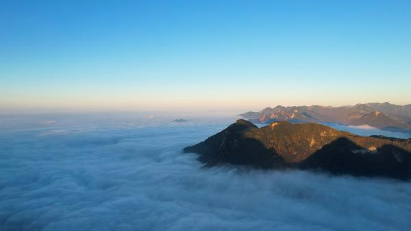 This image was taken over the clouds. You see them till the horizon. Mountain tops look like islands.